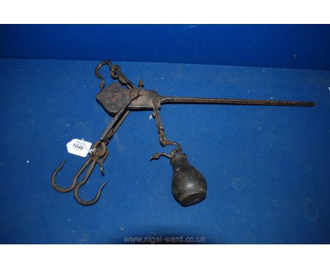 A pair of early Georgian forged iron Balance Scales with weight and ornate hooks