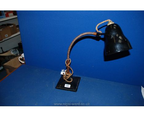 A vintage adjustable Desk Lamp.