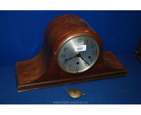 A Deco Mahogany domed mantle Clock having single convex glass door in brass surround opening to reveal alloy Arabic numeral f