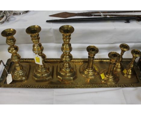 Brass tray, 60 cm long, three pairs of brass candlesticks and single candlestick