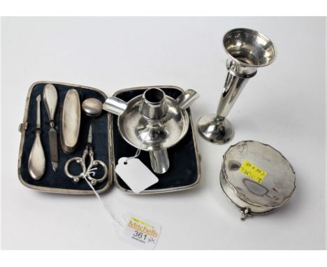 George V silver mounted manicure set, silver spill vase, silver candlestick holder and silver lidded pill box 
