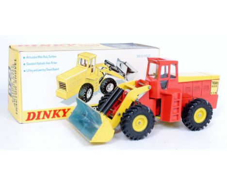 Dinky Toys No.973 Eaton Yale Articulated Tractor Shovel, orange and yellow example with yellow plastic hubs, in the original 