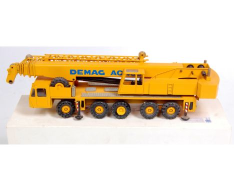 Conrad No.2081 1/50th scale diecast model of a Demag AC335 All Terrain Mobile Crane, yellow example with Demag livery, in the