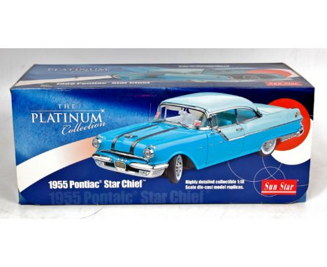 Sun Star 1/18th scale diecast model of a 1955 Pontiac Star Chief, "The Platinum Collection", finished in black and red with c