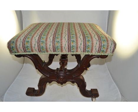 A mid Victorian walnut x-frame stool, white porcelain casters, tapestry seat - W53cm