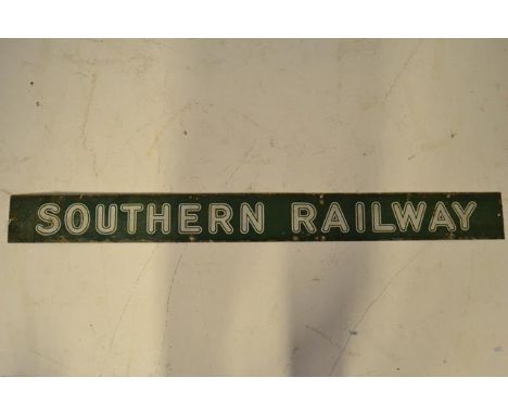 A Southern Railway poster board header enamel sign, white lettering on green ground - 12.5 x 133cm.