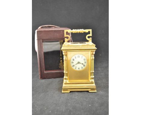 A gilt brass eight day 1/2 hour striking, hour repeating, carriage clock, original lever escapement, circular white enamel di