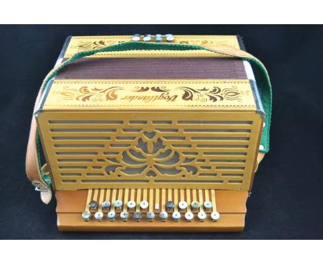 A Vogtlander mid 20th Century twenty eight button accordion - L31cm, with associated case.CONDITION REPORTWe have not played 