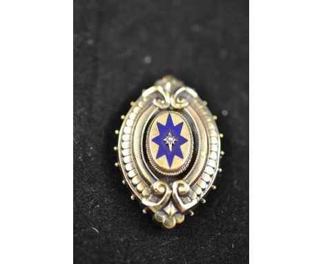 A Victorian yellow metal brooch with blue enamel star decoration set with central seed pearl - 4.5x2.8cm.CONDITION REPORTcomm