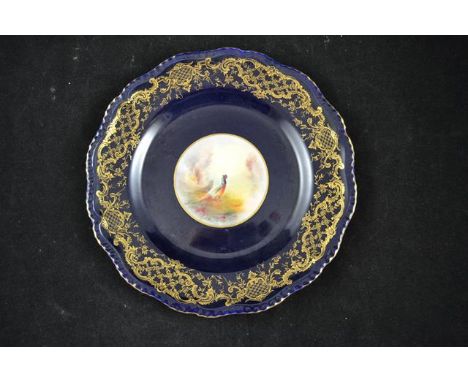 A Royal Worcester royal blue ground plate with central roundel depicting pheasant by Stinton - diam 24cm