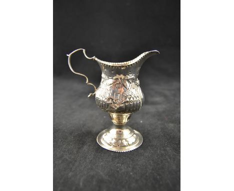 A late Georgian cream jug embossed with hunting scene, loop handle, London 1788 - approx weight 77g/2.4 troy ozCONDITION REPO