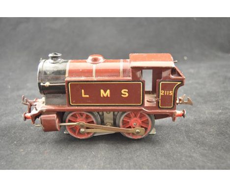 A Hornby electric 20v 0-4-0 engine in LMS maroon liveryCONDITION REPORTmetal fatigue to wheels, light missing from front