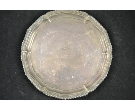 A silver salver with gadrooned edge, presented to Lt. Col. D. J. Goldsmith. R. Signals, Sheffield 1931, maker William Hutton 