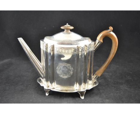 A late Georgian engraved silver teapot with scroll design, wooden handle and knop, London 1796, together with a matching teap
