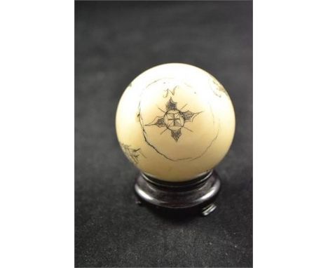 An ivory snooker ball with scrimshaw style carving depicting compass rose, merchantman and sea captainCONDITION REPORTcracks 