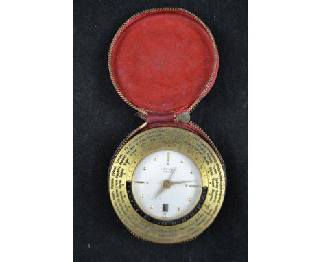 A Hermes 1960's eight day travelling clock, world time on bezel, with hinged stand, in a Hermes leather case (personalised wi