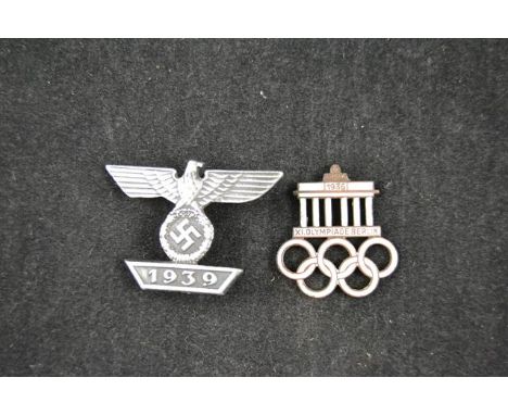 A World War II Nazi Germany bar dated 1939, together with a 1936 Berlin Olympics enamel badge (pin missing)