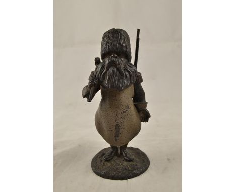 A cold painted spelter inkwell in the form of a Cossack with axe and rifle - H19cmCONDITION REPORTwear to cold painting