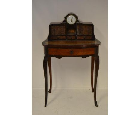 A late 19th century continental bureau de dame, inset single train clock with painted enamel dial, faux book front to upstand