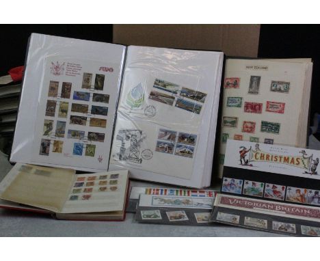 A collection of British and world stamps to include First Day Covers and presentation packs together with a collection of mix