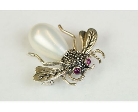 Silver and marcasite brooch in the form of a bug with ruby eyes 
