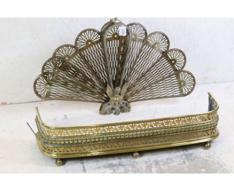 Brass Peacock Folding Firescreen, 55cm high together with a 19th century Brass Pierced Fire Fender, 90cm long 