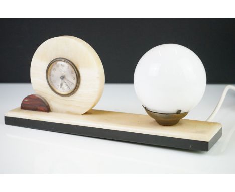 Ucra Art Deco onyx mantle clock with fitted globe light, mounted on a rectangular base, approx 33cm wide 