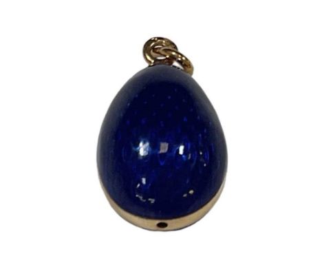 FABERGÉ; a yellow metal blue enamelled egg pendant, height approx 2.5cm, approx 6.3g.
