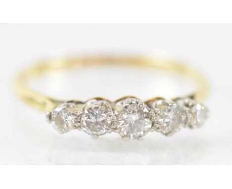 An 18ct yellow gold five stone diamond ring, size Q, approx 2.4g.