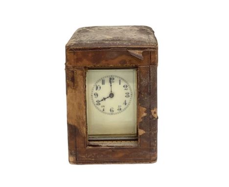 A 19th century French brass cased carriage clock, the white enamel dial set with Roman numerals, in original travelling case,