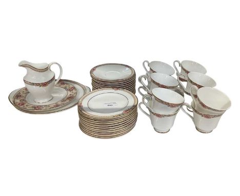 ROYAL DOULTON; a twelve setting tea service decorated in the 'Darjeeling' pattern, comprising twelve teacups, twelve saucers,