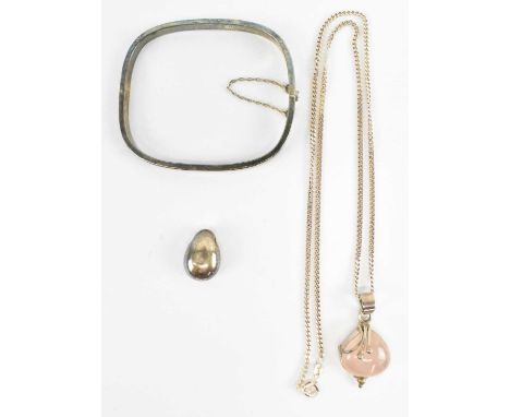 A 925 hallmarked silver bangle, 925 hallmarked silver teardrop pendant and a 925 hallmarked silver rose quartz pendant suspen