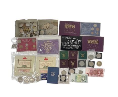 A quantity of sundry all world coinage including two 1970 Coinage of Great Britain and Northern Ireland sets, a 1971 and a 19