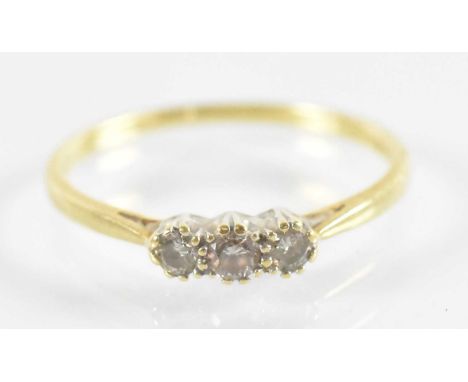 A 18ct yellow gold three stone diamond ring, size X, approx 2.8g.