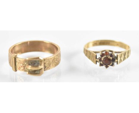 A 9ct yellow gold buckle ring, size S, and a 9ct yellow gold garnet set dress ring, size O, combined approx 6.5g (2).