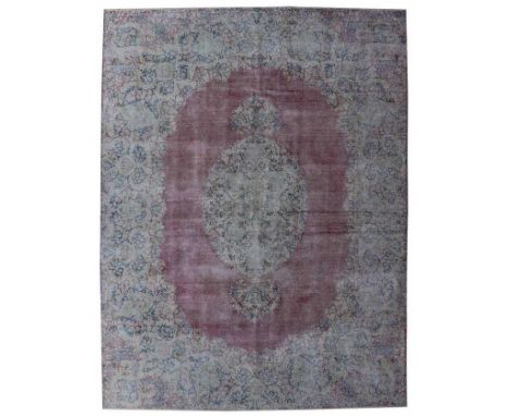 A large Persian Kerman hand knotted woollen carpet, 390 x 290cm.Condition Report: This rug has one slight patch of wear, howe
