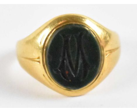 A yellow metal agate set signet ring, marked 'RJ, 22', size G, approx 5.1g.