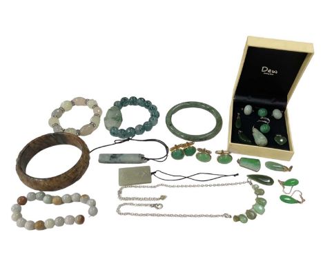A group of jade and jadeite jewellery including two bangles, diameter 7.5cm, two bead bracelets, earrings, pendants, etc.