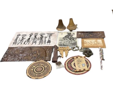 A group of African items including bronze wall hanging mask, height 25cm, pair of ankle bangles, scroll, two wooden vases, he