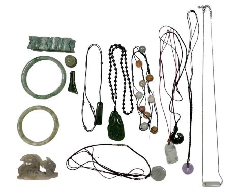 A quantity of jade and jadeite jewellery including pale green bangle, diameter 7.5cm, larger bangle, diameter 8cm, pendants, 