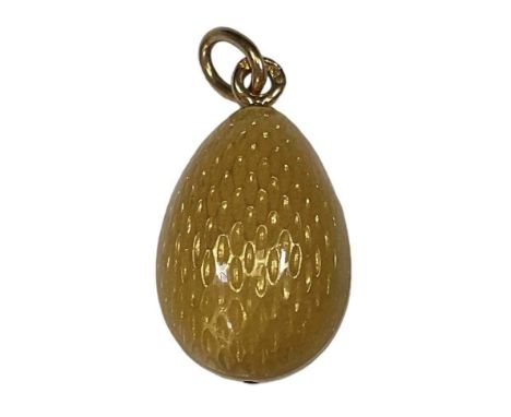 FABERGÉ; a yellow metal mounted yellow enamelled egg pendant, height 2.5cm, approx 6.3g.