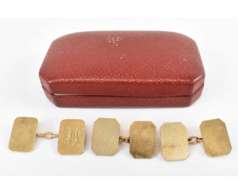 A pair of 9ct yellow gold cufflinks with engine turned decoration and a further engraved cufflink, combined approx 8.6g.