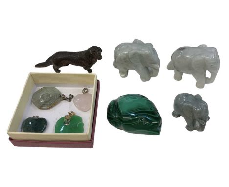 A miniature Venetian type bronze of a dog, height 3.5cm, length 7.8cm, three green carved hardstone elephants, a green carved