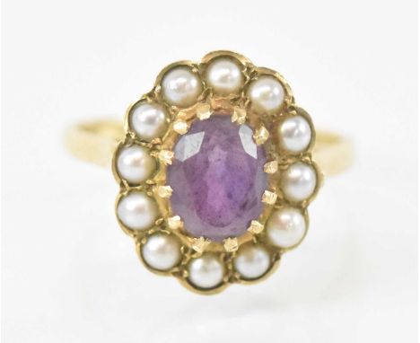A 9ct yellow gold amethyst and seed pearl set ring, the central amethyst approx 1.5ct, size Q, approx 3.9g.
