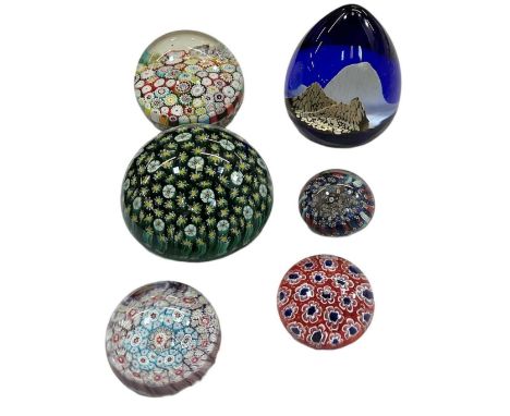A group of six paperweights including Caithness 'Everest', Murano, etc.
