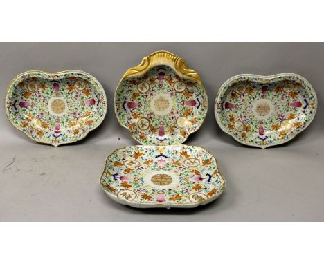 A PAIR OF 19TH CENTURY CHINESE RUYI FORM FAMILLE ROSE PORCELAIN DISHES, each decorated with gilt auspicious roundels reserved