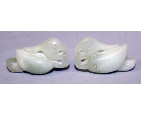 A SMALL PAIR OF CHINESE CELADON JADE PENDANTS, each in the form of a Mandarin duck, each 1.4in long.