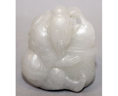 A CHINESE JADE-LIKE PENDANT, in the form of a seated fisherman pulling a carp from out of a basket, 1.9in high x 1.6in wide a