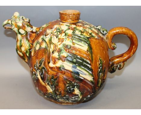 A LARGE CHINESE TANG STYLE CERAMIC CHICKEN EWER, applied with white, green and ochre glazes and with naturalistic moulded dec