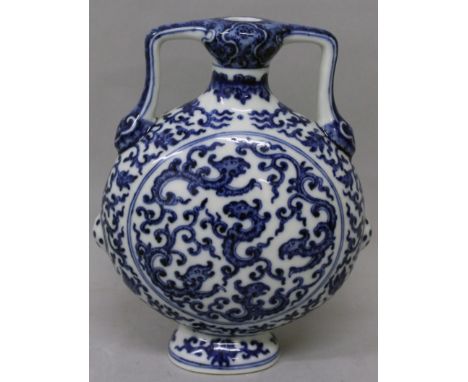 A CHINESE MING STYLE BLUE & WHITE PORCELAIN FLASK, each domed side decorated with stylised dragons, the base with a Qianlong 